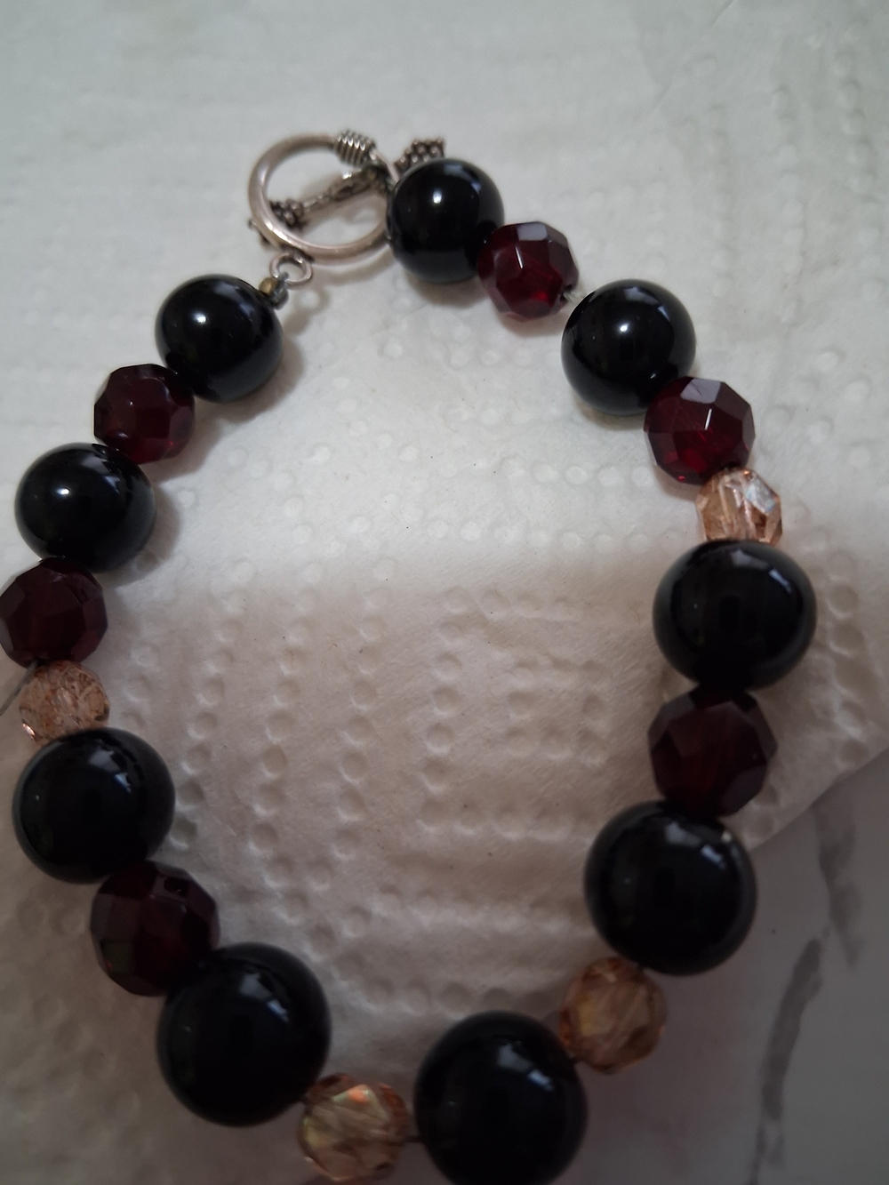 Vintage GlSource Unknown Black and Garnet Beaded Bracelet with Champagne Accents